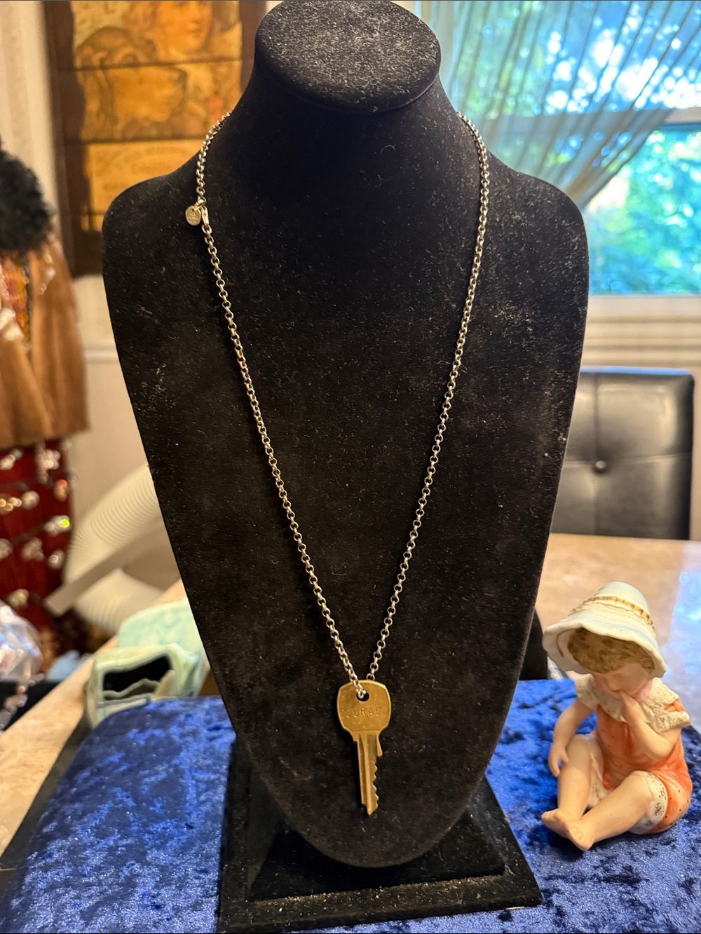 The Giving Keys gold, and silver tone necklace with key saying courage